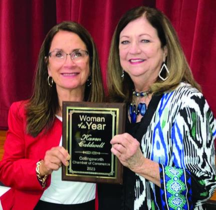 Karen Caldwell, left, receives Woman of the Year from Margret Wood.