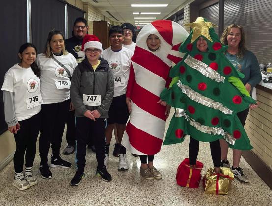 Participants line up prior to the Memphis Independent School District (ISD) Parent/Community Engagement Jingle Bell Run/Walk Saturday, Dec. 3 at Memphis High School. Memphis ISD thanks Blooms and Bolls, The Cottage, Fat &amp;amp; Happy BBQ, Memphis Chamber of Commerce, Mimi’s Bakery, Morgan Jaynes Boutique, The Rock Inn Café, Sonic and Thriftway for the donation of door prizes. Photo Courtesy of Memphis ISD