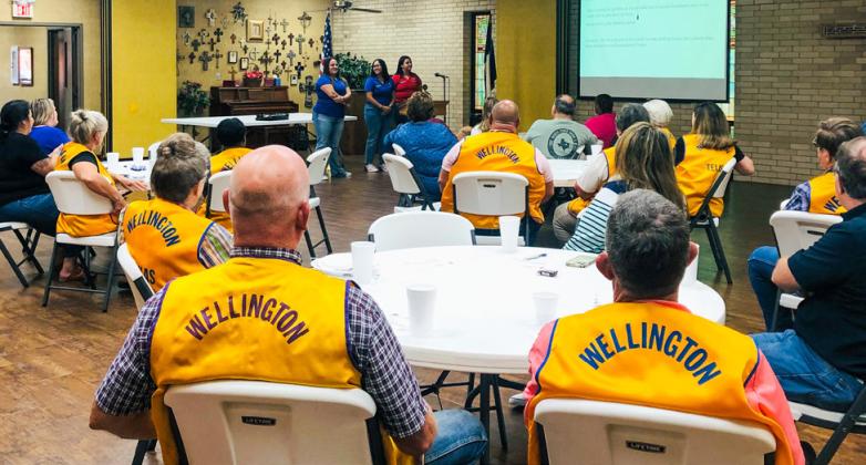 4-H Water Ambassador Brecklyn Powell, left, answers questions from Wellington Lions following the presentation, while Ambassadors Anna Granadoz and Jacy Lampe listen intently. The Red River Sun/Bev Odom