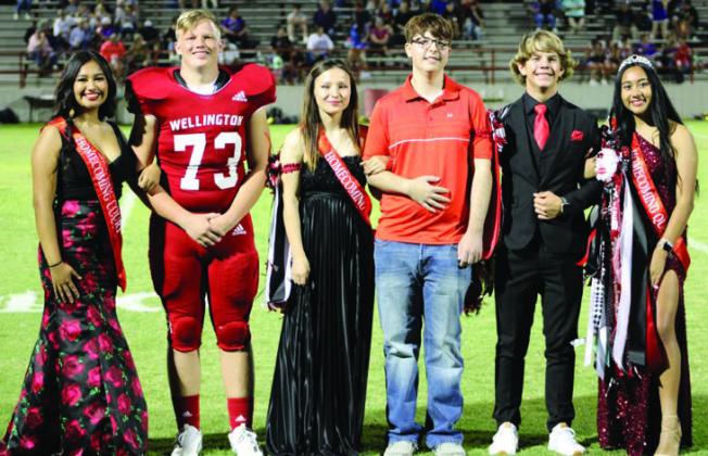 The 2022 Rocket Regiment homecoming royalty receive accolades during halftime of the Skyrockets vs. River Road football game. From left, Second Runners-Up Emily Robles and Corni Klassen; First Runners-Up Angela Molina and Noah Wright; Band King and Queen Caleb Weinette and Jossaline Cervantes. For additional photos, see 10A.