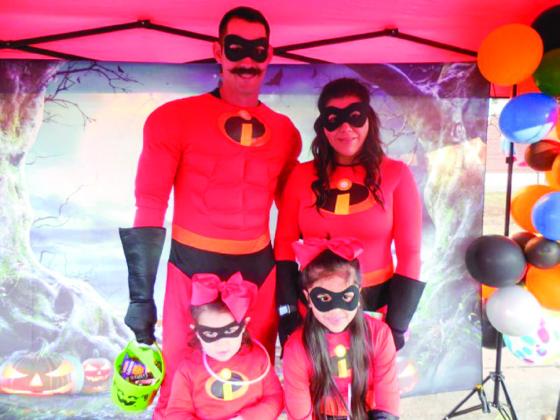 Kevin Long, dressed as Mr. Incredible, along with wife Monica Long and their daughters, Kobi and Kelbi, win the adult male category, earning $50. Photos by Memphis Chamber of Commerce