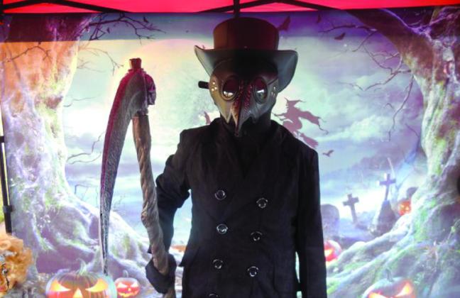 Murphy Cook, dressed as a plague doctor, wins the male child category, earning $50.