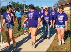 Daniel Brown, of Abilene, attired in his blue “Texas 254 Running Club” shirt, attends the Wellington Professional Women’s Club (WPWC) Bubble Run.