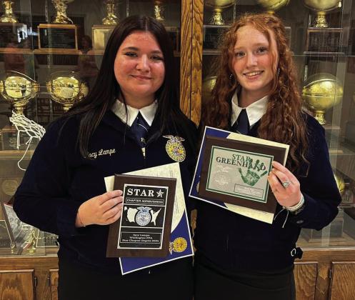Sophomore Jacy Lampe, left, and freshman Bailey Page accept some of the top honors at the Wellington Future Farmers of America (FFA) Awards Banquet, held Wednesday, May 7 in the Wellington High School Commons. Among other awards, Lampe received the Wellington FFA Star Chapter Degree 2024, while Page accepted the Star Greenhand accolade. Courtesy Photo