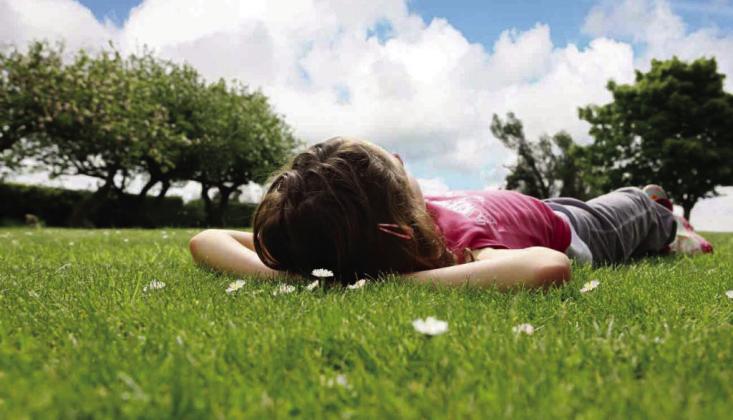 A girl studying clouds
