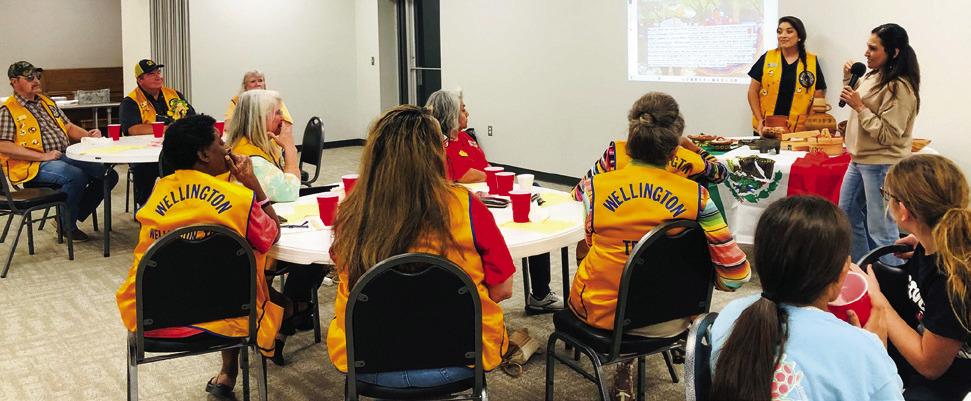 Maria Avalos, right, and Lion Noemi Pena encourage members of the Wellington Lions Club to embrace the colorful and beautiful diversity that Mexican Americans and all cultures bring to the United States. Avalos displayed kitchen items from Mexico that her mother uses daily. The Red River Sun/Bev Odom