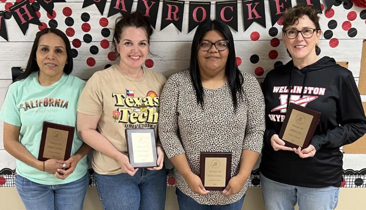 With five years of service to Wellington Independent School District, employees Abigail Castañeda, left, Amy Henard, Karina Contreras and Shillalie Jones accept their plaque awards. Not pictured: Creighton Killian.