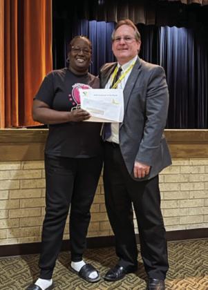 Memphis High School paraprofessional Tammy Henderson, left, is named the March Memphis Independent School District (ISD) Employee of the Month by Memphis ISD Superintendent William Alexander. Photos Courtesy of Memphis ISD