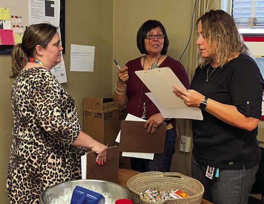 Austin Elementary School educators, as well as Austin Elementary School Principal Trina Hardin, right, study the recent State of Texas Assessments of Academic Readiness (STAAR) redesign during a Professional Learning Community (PLC) meeting. Photo Courtesy of Memphis ISD