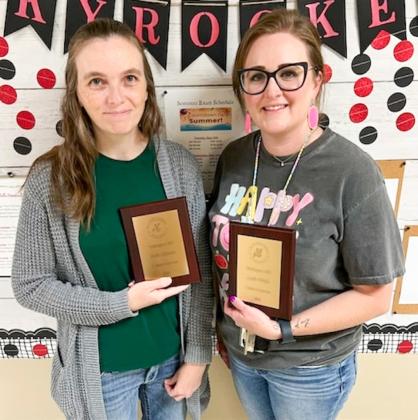 For five years of service to Wellington Independent School District, Susie Klassen, left, and Leslie Wiebe receive walnut plaques.