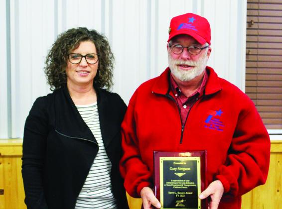 Motley County Sign Technician Gary Simpson, right, receives the Terry L. Keener award from Childress District Business Operation Manager Anita Thompson Thursday, Dec. 1. Photo Courtesy of Childress District of TxDOT