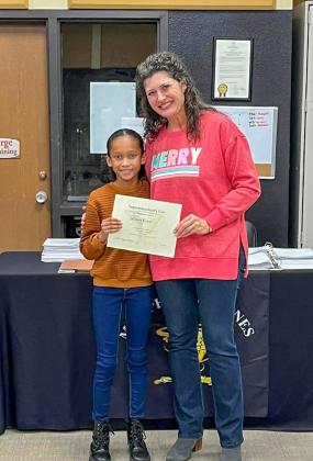 Austin Elementary School fourth-grader Jaedah Casas accepts the Superintendent’s List designation from Memphis ISD Board of Trustees President Sarah Cook.