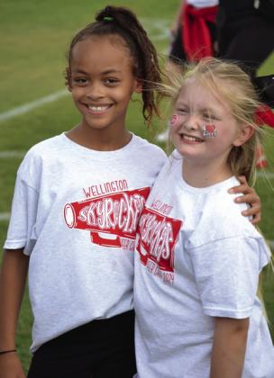 Skyrocket mini cheer campers shout football victory vibes
