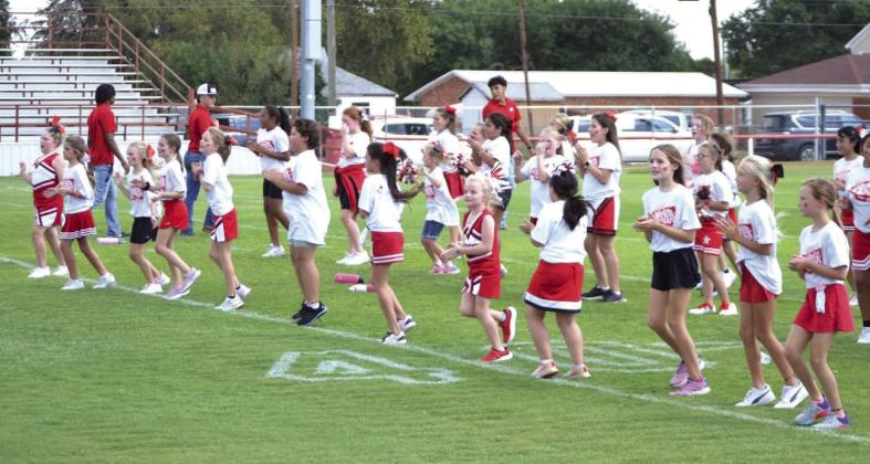 Skyrocket mini cheer campers shout football victory vibes