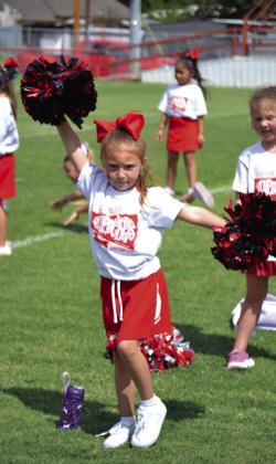 Skyrocket mini cheer campers shout football victory vibes