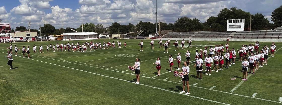 Skyrocket mini cheer campers shout football victory vibes