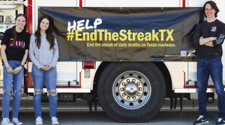 Family, Career and Community Leaders of America (FCCLA) members Kara Palomo, Meg Ridens and Darren Pratt host a Traffic Safety Fair in conjunction with the Texas Department of Transportation (TxDOT) Monday, Nov. 7 at Childress High School. The Red River Sun/Elizabeth Tanner