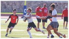 The Childress Bobcats and the Wellington Skyrockets face off in a recent 7-on-7 tournament at Fair Park Stadium in Childress. Through the Lens of Liz/Elizabeth Oronia