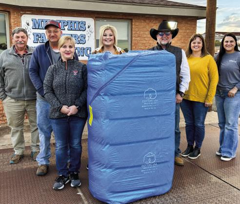 K&amp;amp;W Farms brings in the first bale of cotton at Memphis Farmers Gin on Wednesday, Nov. 2. From left, Memphis Farmers Gin Manager Jamie Snider, K&amp;amp;W Farms’ Wade and Kitzy Pepper, K. Huddleston Sales’ Kristen Altman and Kevin Huddleston and Fowler Agency’s Melody Middleton and Kate Woods. Photo Courtesy of Memphis Farmers Gin