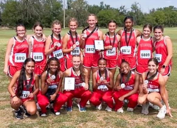 The Wellington Lady Rocket and Lady Firecracker cross country teams earn championship finishes at the Second Annual Hollis Cross Country Meet on Saturday, Sept. 6 in Hollis, Okla. Front row, from left: Lady Rockets Sabrina Segovia, Angela Lewis, Taytum Kane, Kobee Lewis, Aleah Lewis, Anna Henard. Back row, from left: Lady Firecrackers Abbygale Torrez, Jessalee Peters, Halle Hedrick, Ava Kate Inman, Kaesyn Kane, Claire Kane, Priscilla Marentes, Evie Henard, Quinn Roberson. Wellington High School