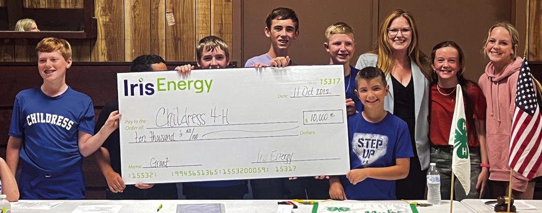 Childress County 4-H club officers accept a check in the amount of $10,000, which was granted through the Iris Energy Community Grant Program and presented by Iris Energy Community and Employee Relations Manager Nicole Dill at the recent Childress County 4-H meeting Tuesday, Oct. 11 at the Fair Park City Auditorium. For more, see page 7B. The Red River Sun/Nicole Dill