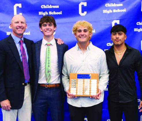 Julian Silva, right, and Conner Keys, second from left, are awarded Bobcat Track Co-Most Valuable Player, and Colton Teichelman, second from right, is awarded Bobcat Field Most Valuable Player, presented by head track coach Lee Brandon.