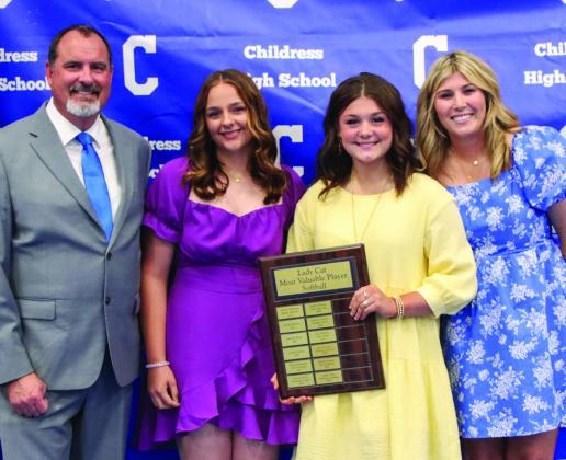Ansley Parr, second from left, is awarded Softball Defensive Most Valuable Player, and KJ Felton, second from right, is awarded Softball Offensive Most Valuable Player, presented by head softball coach Charlsi Bozeman and girls’ coordinator Eric Davis.