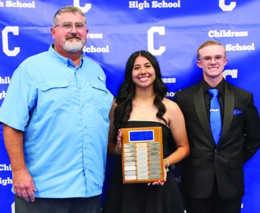 Isabella Jurado, center, and Tyler McGee, right, are awarded Bobcat and Lady Cat Golf Most Valuable Player, presented by head golf coach Trenton Boyd.