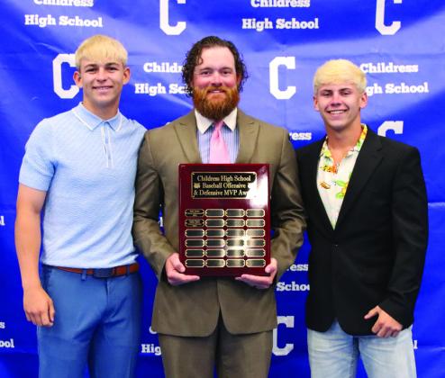 Drake Rabe, left, is awarded Baseball Defensive Most Valuable Player, and Cash Hightower, right, is awarded Baseball Offensive Most Valuable Player, presented by head baseball coach Jonathan Wise.