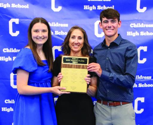 Faith Foster, left, and Jace Keys, right, are awarded Bobcat and Lady Cat Tennis Most Valuable Player, presented by head tennis coach Mary Trimmer.