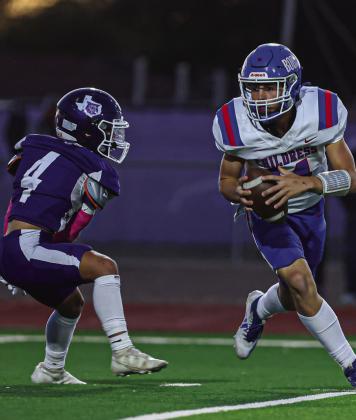 Childress’ Koen Galligan (14) searches for a receiver against the Dimmitt Bobcats Friday, Oct. 25.