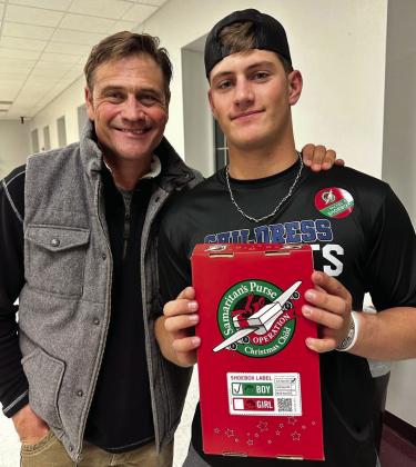 Stran Smith, along with son Scout Smith, pack shoeboxes during First Baptist Church’s 2022 Packing Party Monday, Nov. 14. At the event, volunteers packed 329 boxes, which will be sent to children around the world through Samaritan’s Purse Operation Christmas Child. Additional boxes, containing toys, school supplies and personal hygiene items, can be dropped off at First Baptist Church of Childress, 300 Ave. C NW, through Sunday, Nov. 20. Courtesy Photos