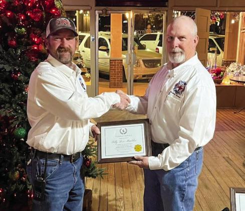 Memphis Volunteer Firefighter Billy Don Mauldin receives a five-year service award, presented by Memphis Volunteer Firefighter Terry Altman. “A special congratulations to these four firemen for their special recognition,” Altman said. “These men often go above and beyond the call of duty.”