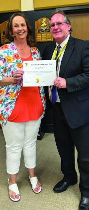 Memphis High School history teacher Wendy Altman is the Memphis Independent School District (ISD) Secondary Teacher of the Year. Altman is awarded by Memphis ISD Superintendent William Alexander.