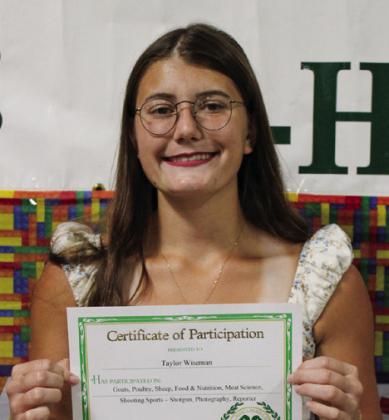 Taylor Wiseman participated in Food and Nutrition, Goats, Poultry, Photography, Sheep and Shooting Sports – Shotgun and was High School Club Reporter.