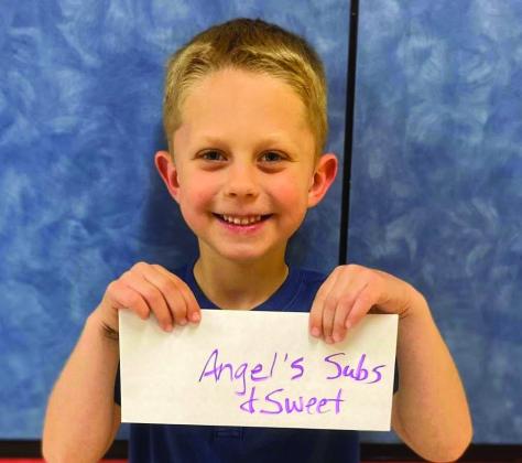 Kindergartener Will Patterson accepts the Angel’s Subs &amp;amp; Sweets gift certificate on behalf of his mother, Abby Williams. Around 150 parents joined their children for lunch Friday, April 4 for Go Blue Day. Visitors registered for gift certificates provided by the restaurants and the Collingsworth County Child Protective Service Child Welfare Board. Wellington Elementary School
