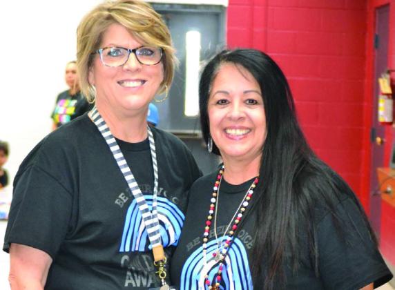 Collingsworth County Child Protective Service Child Welfare Board members Donnie Carter, left, and Maria Granados also serve as paraprofessionals at Wellington Elementary School. The ladies arranged the Sparkler “Go Blue Day” events.