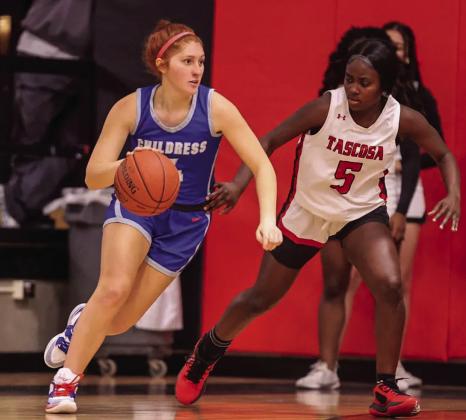 Lady Cat Chloe Teichelman (4) dribbles around Tascosa’s defense.
