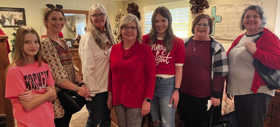 Carrie Warren and her daughter, Cameron Warren, gather with visitors in the master bedroom of their stylish Childress St. home during the 2023 HUGS Holiday Home Tour. From left, Chloe Peters, Ashley Peters, Doris Wilbur, Carrie Warren, Cameron Warren, Lisa Wilhelm, Nicole Self.
