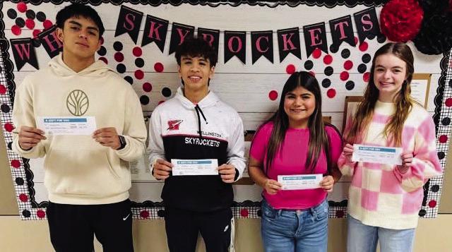 Wellington High School students Anthony Ortiz, left, TJ Salinas, Raelea Davila and Addy English accept lunch gift certificates in a recent drawing. Angel’s Subs &amp;amp; Sweets and Brother-Sisters of Our Military Adventures (BOOM) provide the complementary lunch gift certificates.