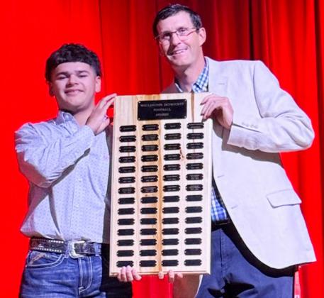 Wellington High School senior KJ Molina receives the Football Larry Wright Memorial Award, presented by Athletic Director Greg Proffitt.