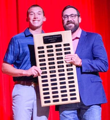 Wellington High School freshman Cix Killian garners the Boys’ Basketball Fighting Heart Award, presented by Coach Colton Holmes.