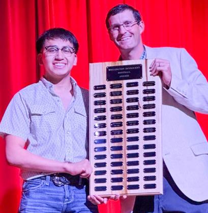 Wellington High School senior Joey Orozco garners the Football Larry Wright Memorial Award, presented by Athletic Director Greg Proffitt.