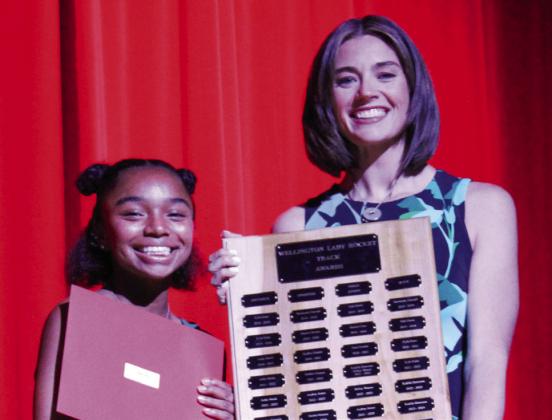 Wellington High School freshman Aleah Lewis garners the Girls’ Track Field Award, presented by Coach Courtney Head.