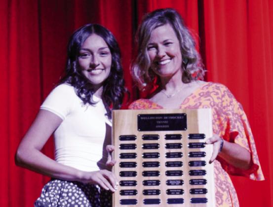 Wellington High School freshman Ingrid Granadoz garners the Tennis Most Improved Girl Award, presented by Coach Amy Inman.