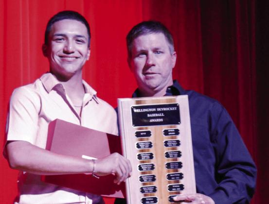Wellington High School freshman Alex Orozco accepts the Baseball Most Valuable Player Award, presented by Coach Jeff Anderson. Not pictured: Junior Tiny Hinojosa received the Boys’ Basketball Offense Award. Congratulations WHS athletes.