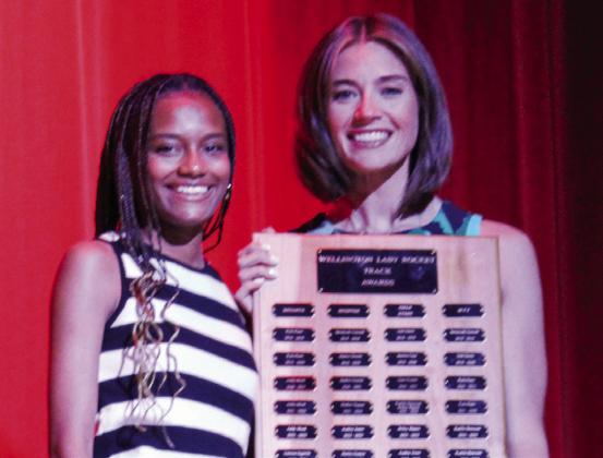 Wellington High School junior Angela Lewis receives the Girls’ Track Sprinter Award, presented by Coach Courtney Head. The Red River Sun/Shauna Salinas
