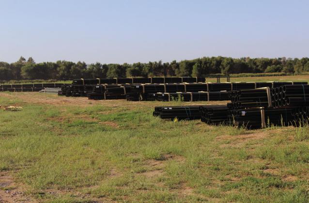 Row and rows of brand-new poly pipeline material sits in a Collingsworth County farmer’s pasture, ready for installation. GreenLight Gas (GLG) General Manager John Mark Ferrel expressed his appreciation for the farmers being so willing to allow not only pipeline easements across their property but for them letting GLG use their land to park equipment and store pipe during the installation process.