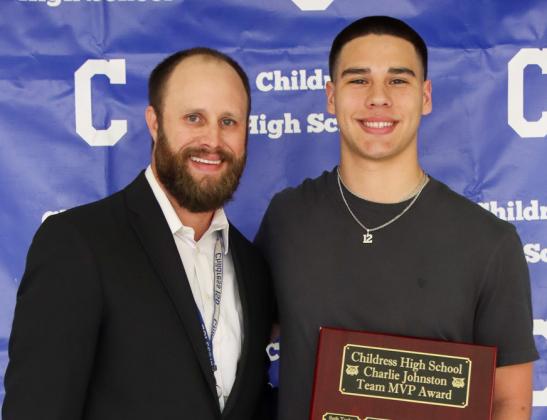 Jacob Mora receives the Charlie Johnston Team Most Valuable Player Award, presented by Athletic Director Bo Helm.
