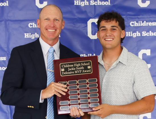 Colton Teichelman receives the Jackie Smith Defensive Most Valuable Player Award, presented by Defensive Coordinator Lee Brandon.